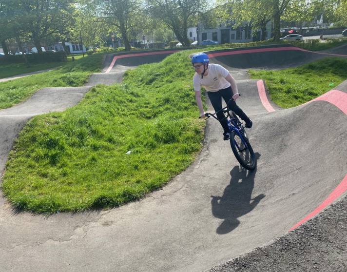 Student riding a BMX bike around an outdoor pump track on a sunny day, as part of Glasgow Kelvin College’s Pathways to Employment Skills programme Student riding a BMX bike around an outdoor pump track on a sunny day, as part of Glasgow Kelvin College’s Pathways to Employment Skills programme